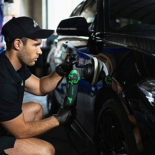 Person using a polisher on a car.