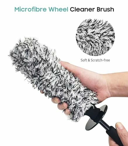 Hand holding a microfiber wheel cleaner brush, soft and scratch-free.